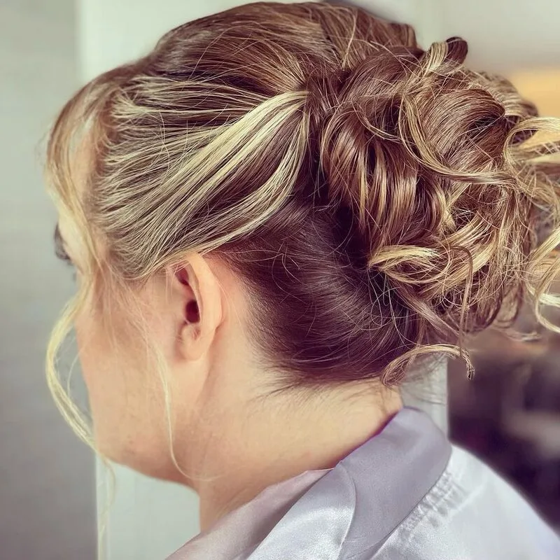 Bridal updo with flowers by Shear Colour